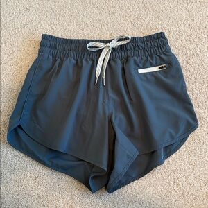 Vuori Women's Dark Slate Athletic Shorts with White Drawstring